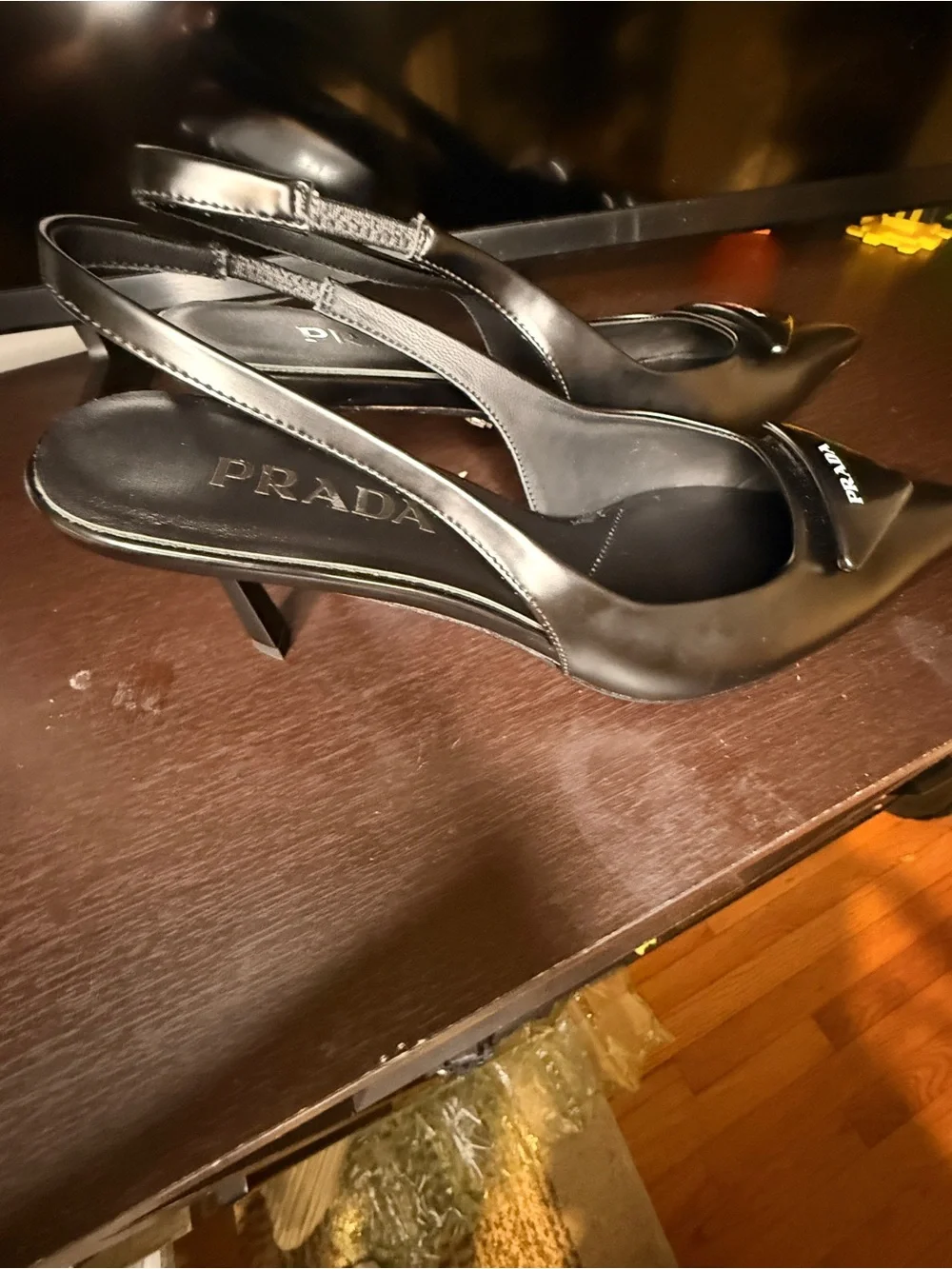 Prada Black Leather Pointed Slingback Heels with Logo Plaque